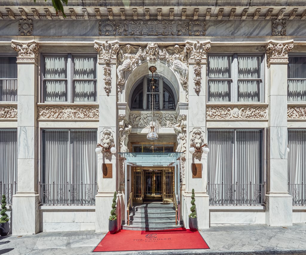 An ornate, white marble building with a grand entrance and red carpet in Atlanta, Georgia.