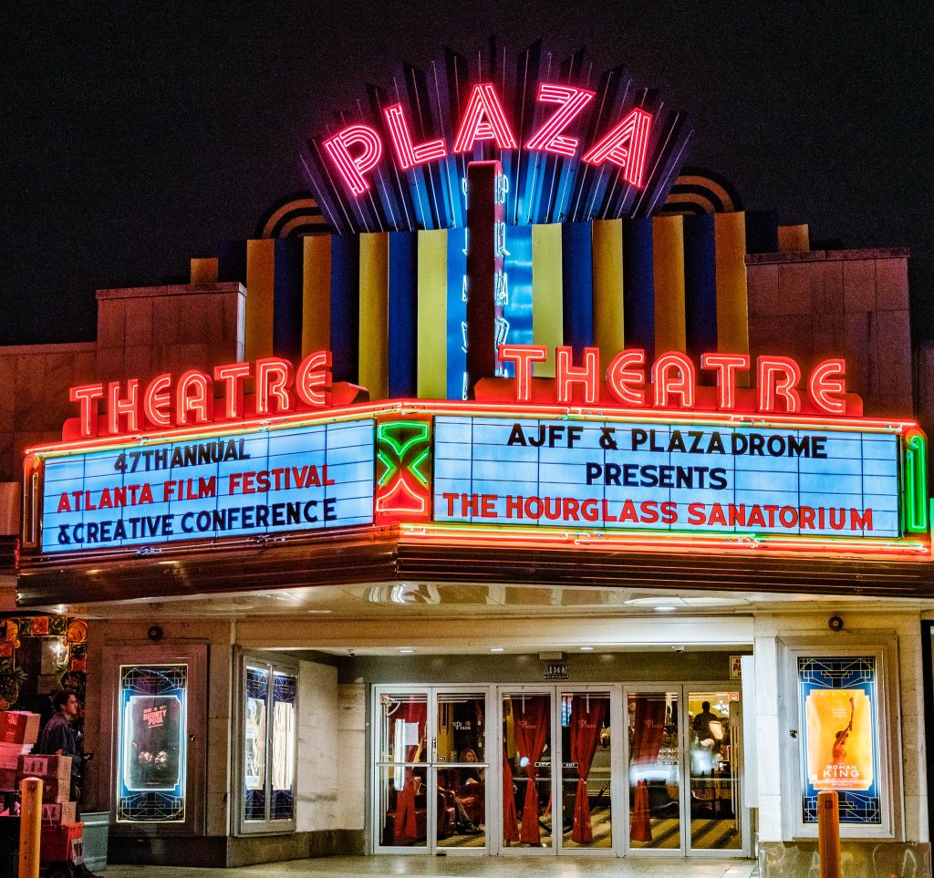 A vibrant neon sign advertises the 47th annual Atlanta Film Festival at the Plaza Theatre in Atlanta, Georgia.