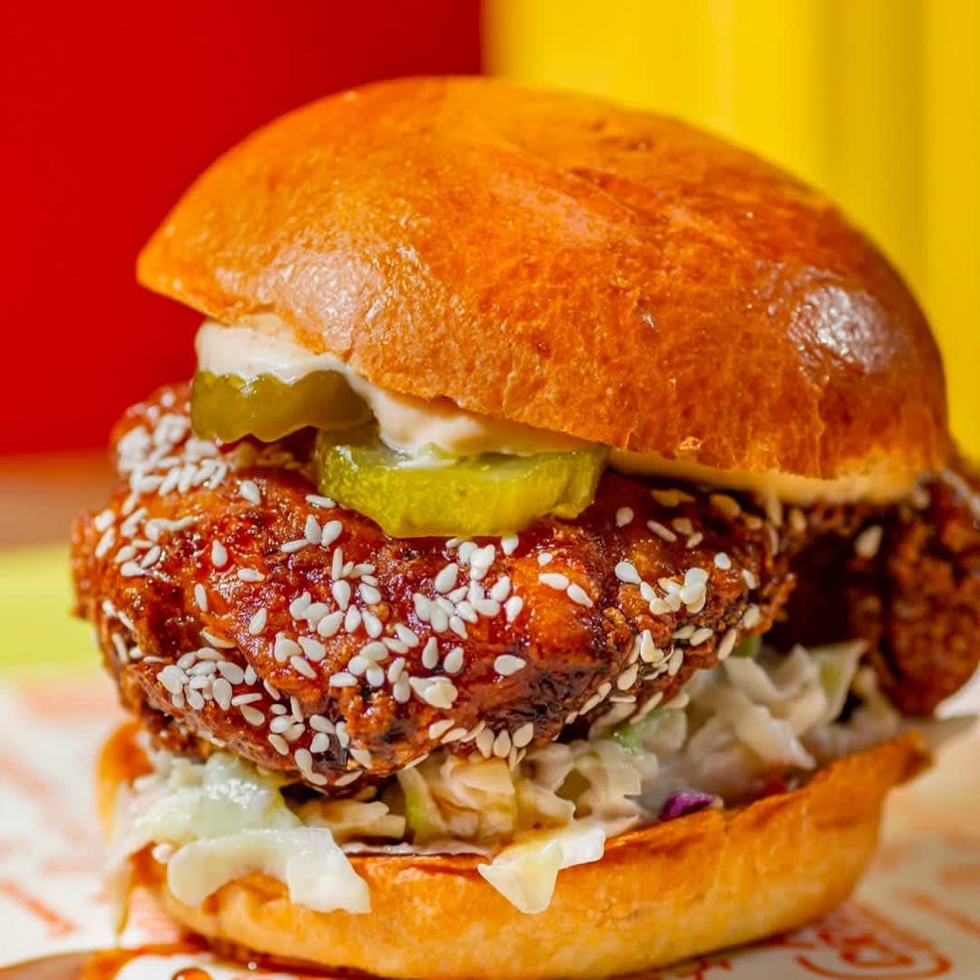 Summerhill 8 a chicken sandwich with pickles and coleslaw