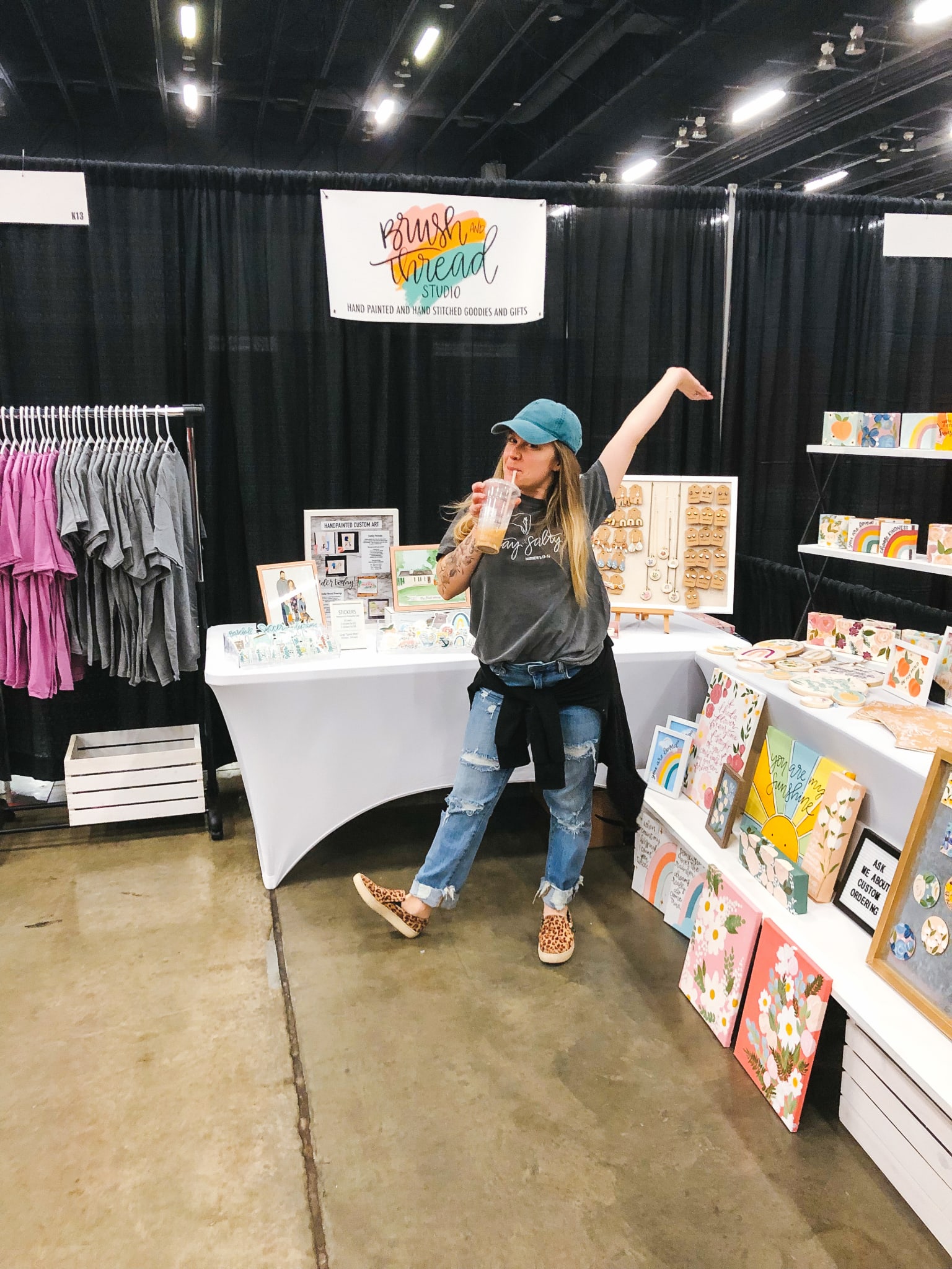 A woman in her pop up shop booth at the Georgia Pinners Conference