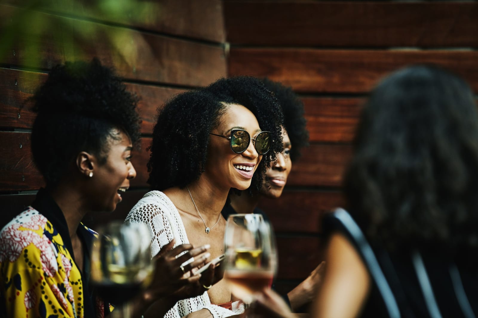 A group of friends enjoying wine and each others company.