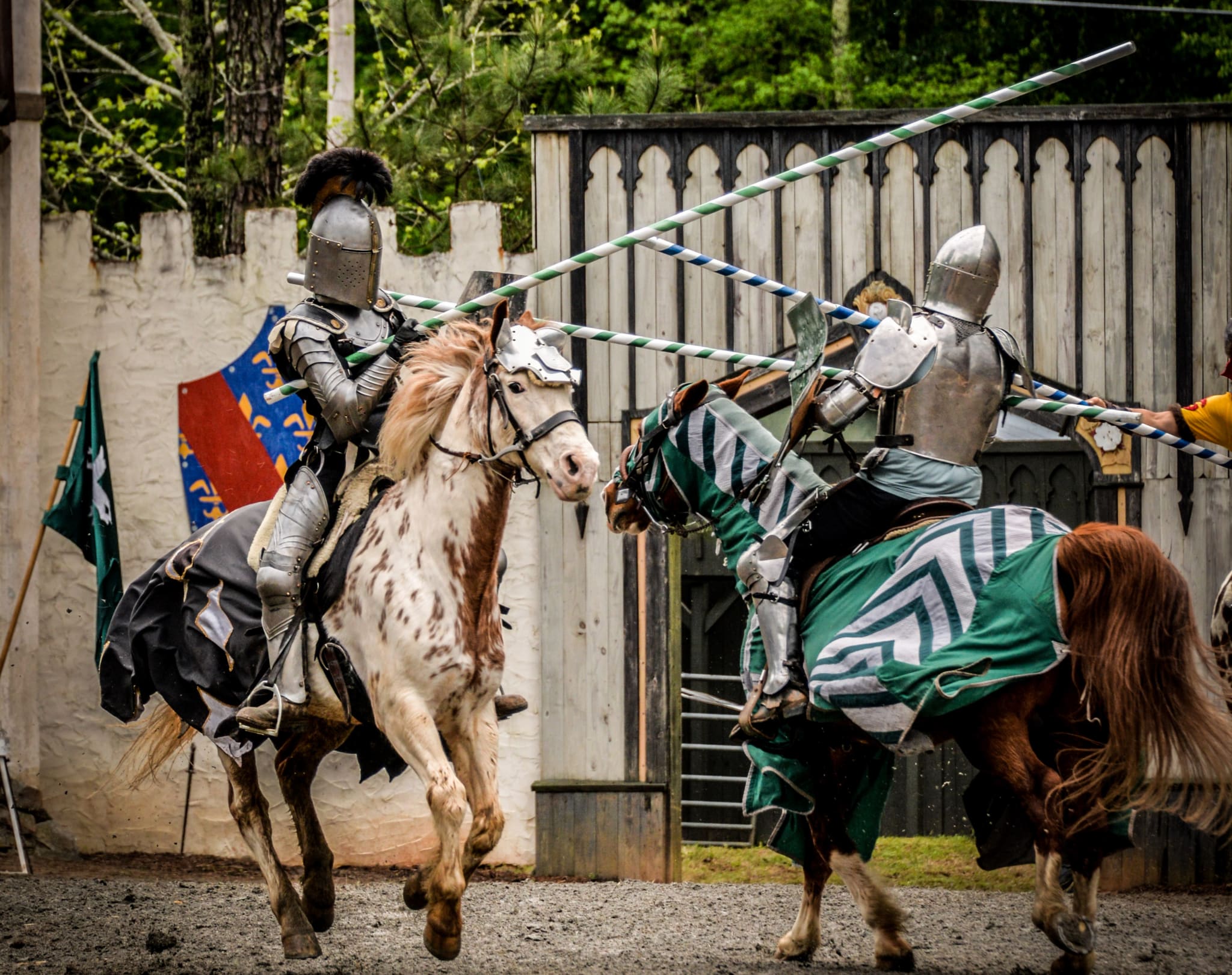 Two knights in full armor joust on horseback in a medieval tournament in Atlanta, Georgia.