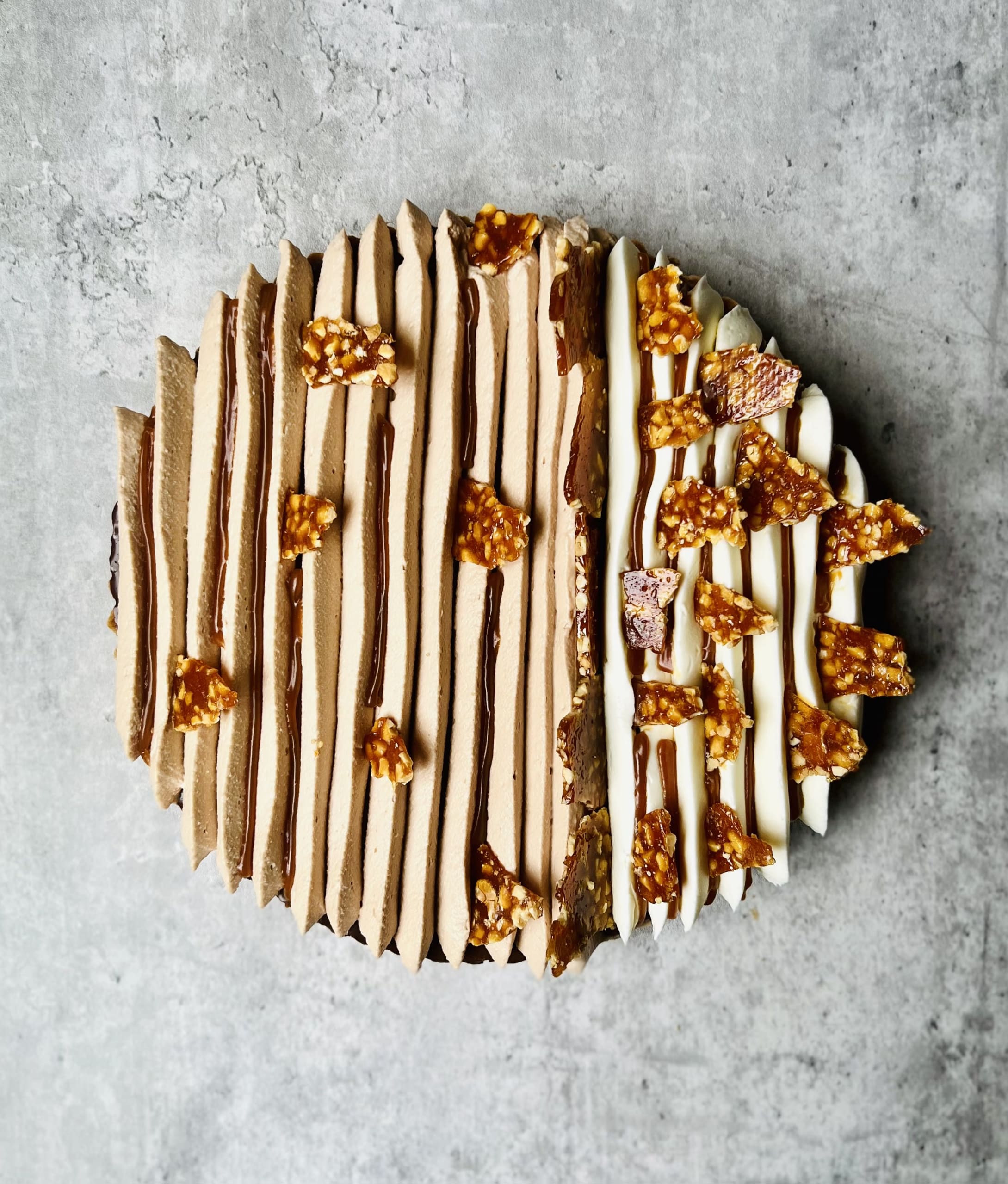 Top Pastry Chefs to Check Out in Atlanta 5 A beautifully decorated dessert with alternating layers of caramel and white cream, topped with caramel drizzle and crushed nuts in Atlanta, Georgia.