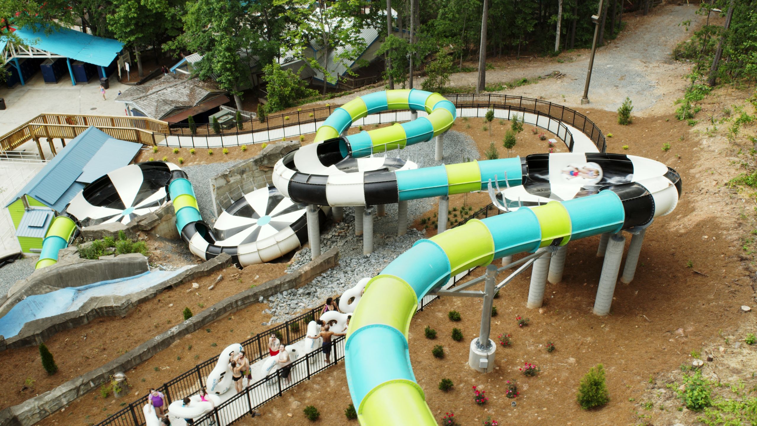 An aerial view of a colorful, winding water slide complex at a water park in Atlanta, Georgia.