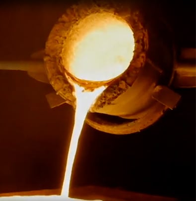 Mike Jakob 2 Molten metal pours from a crucible in an industrial setting in Atlanta, Georgia.