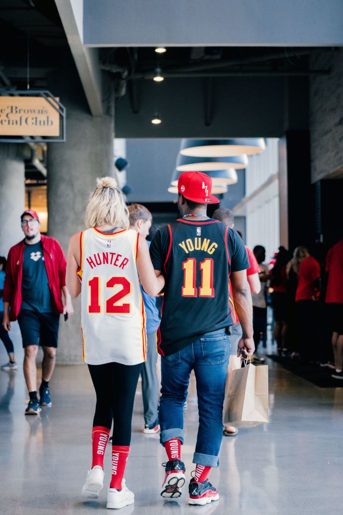 The jerseys tell the story of this couple's favorite Hawks' team members