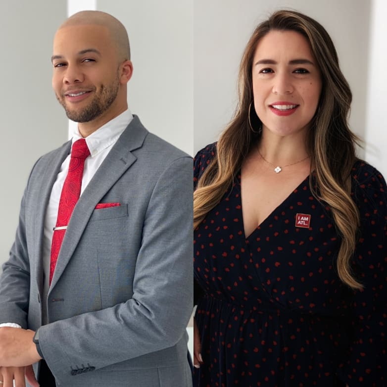 Two New Managers Join ACVB’s Marketing Team 1 A man and woman stand side by side, both dressed in business attire with red accents in Atlanta, Georgia.