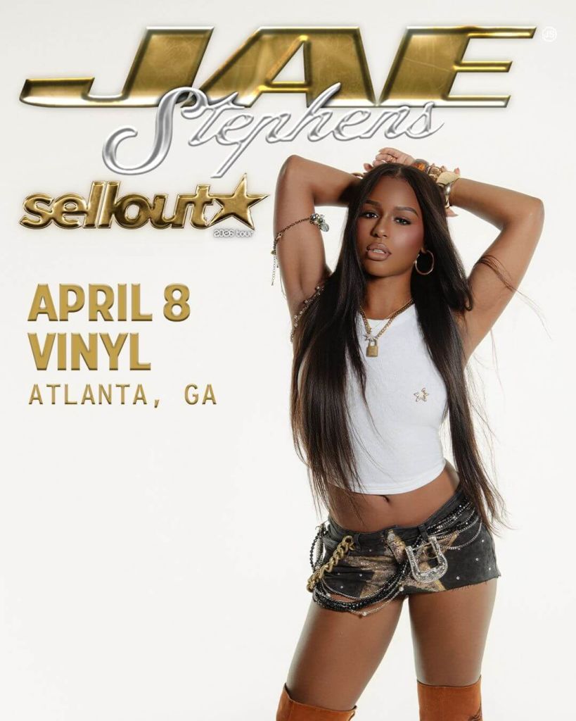 Jae Stephens, a stylish woman with long hair, poses confidently in a white top and black shorts, promoting her 'Sellout 2026 Tour' in Atlanta, GA on April 8th at Vinyl in Atlanta, Georgia.