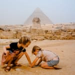 Casually playing in the sand in front of the Sphynx and Giza Pyramids