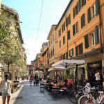 Here you can see lots of little restaurants on the little street of Bologna