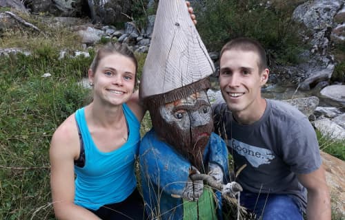 Posing with one of many hand-carved statues outside Rifugio Levi Molinari