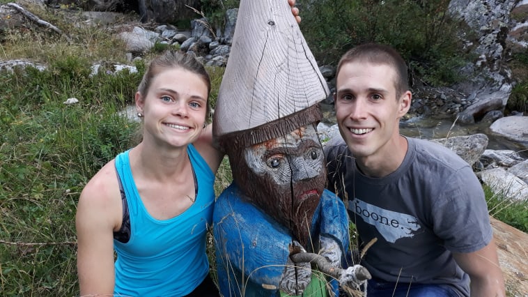 Posing with one of many hand-carved statues outside Rifugio Levi Molinari