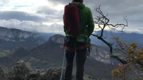 Escalade Presles - Major site of long route climbing in France. - On kind that f a terrace approximately at the middle of the route. The clouds are coming.