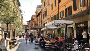 Bologna - Typical historic and characteristic Italian city. Good food and also the starting point of The Way of Gods - Here you can see lots of little restaurants on the little street of Bologna