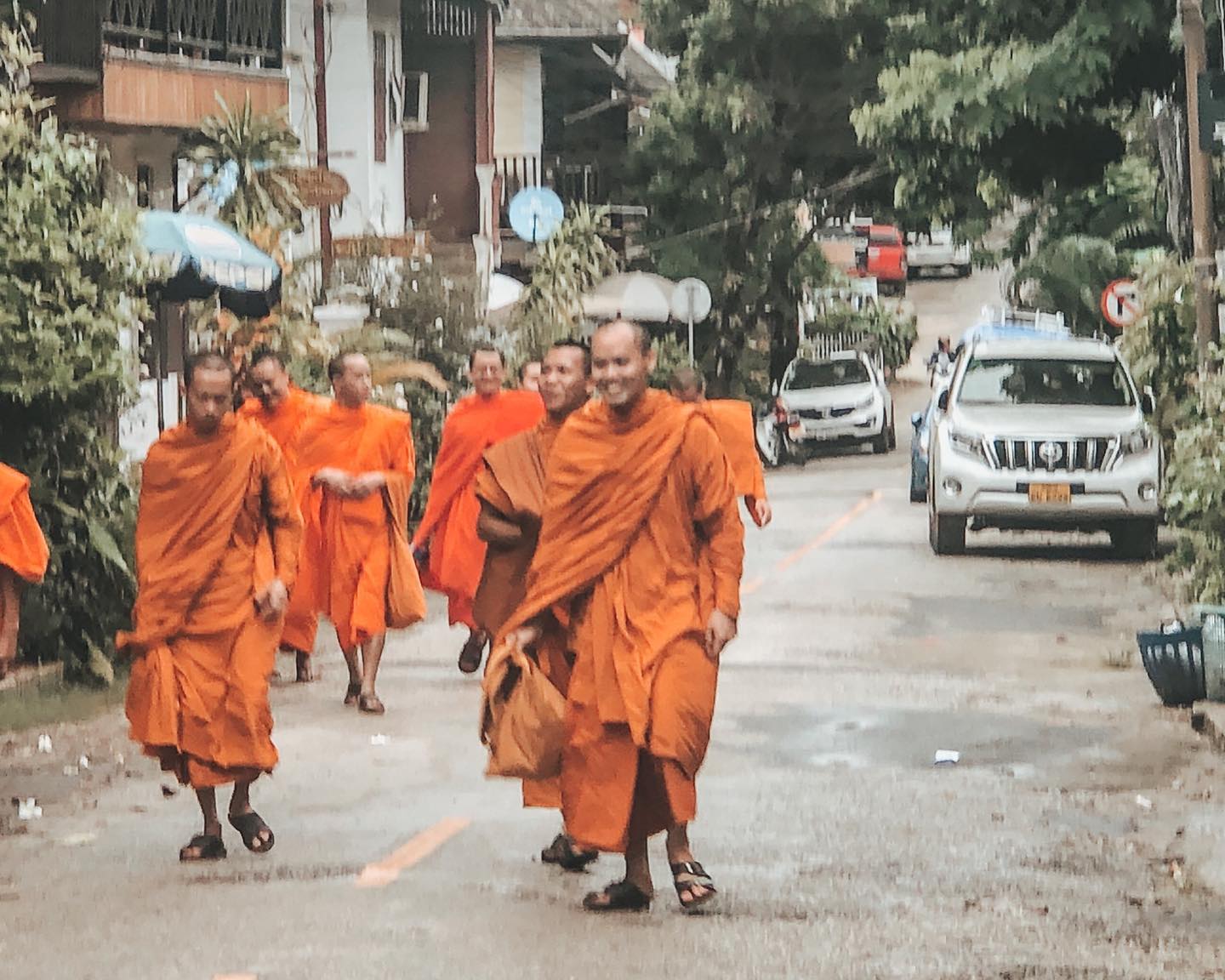 Monks walking through Luang Prabang during the day