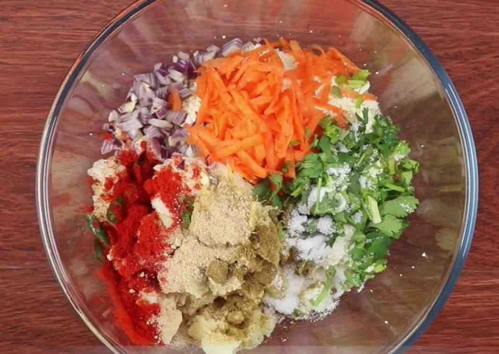 Mixing the spices and veggies together