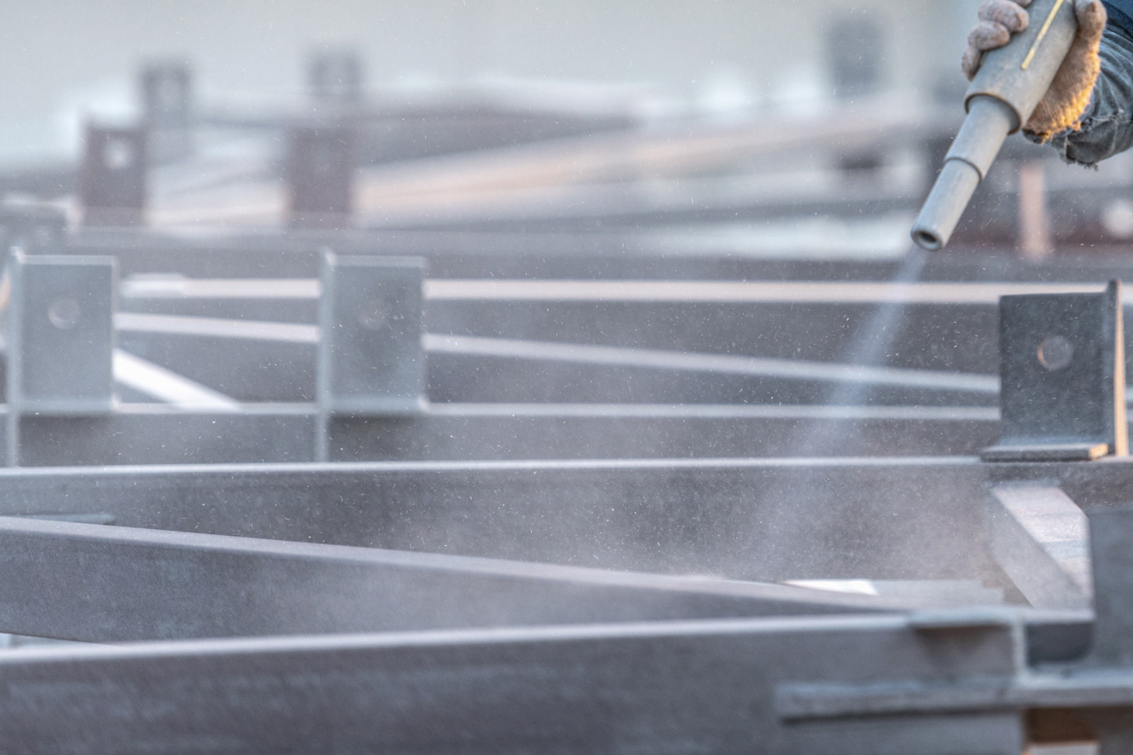 Industrial sandblasting services cleaning fabricated steel components in Appleton, WI.