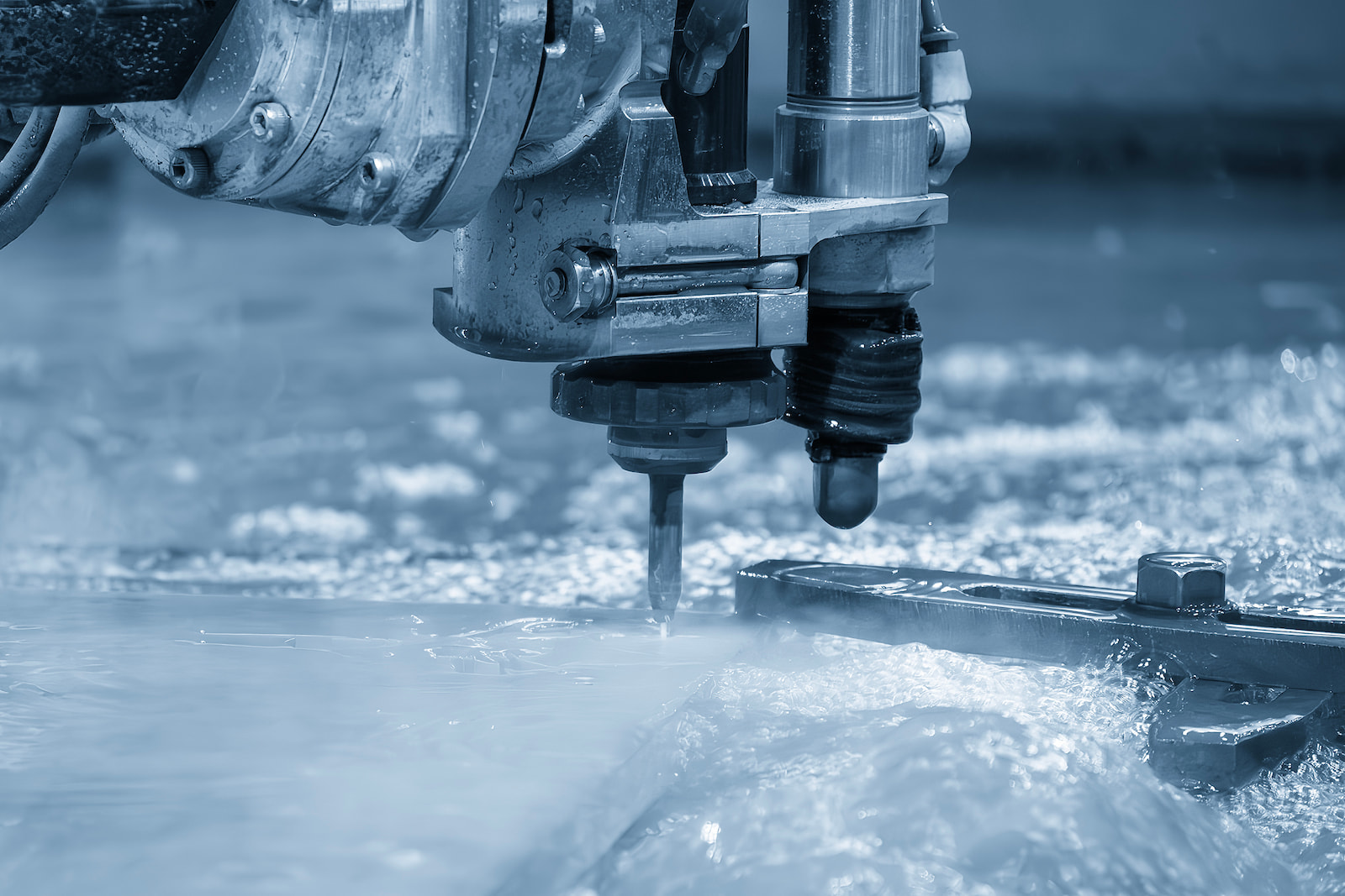 Precision waterjet metal cutting equipment fabricating custom industrial parts in Appleton, WI.