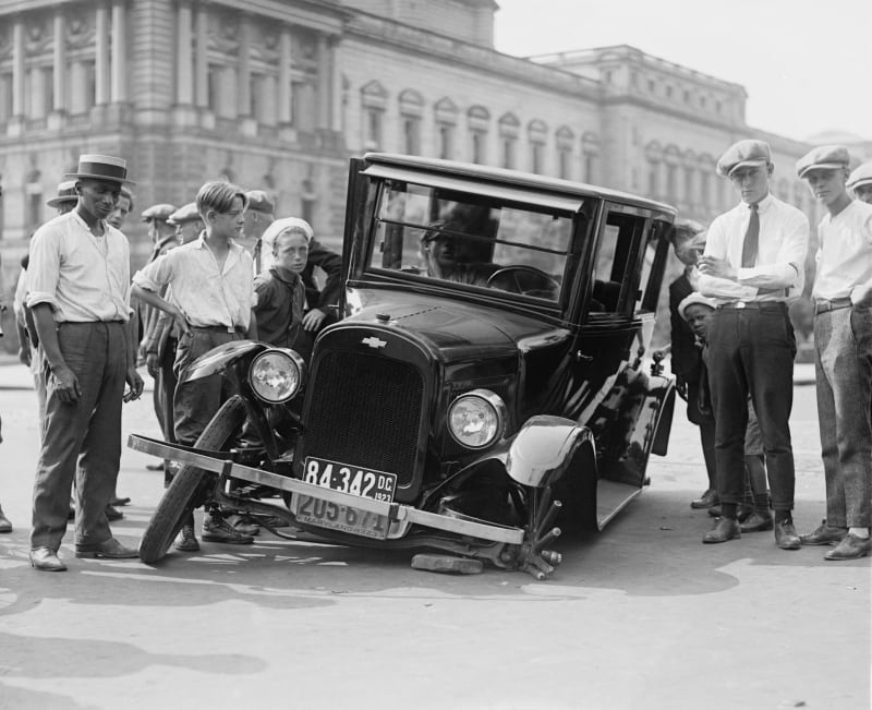 Old B&W photo of people standing around a broken down car. The unreliable other. (Photo from Pexels: https://www.pexels.com/photo/grayscale-photo-of-people-standing-near-the-wrecked-vintage-car-78793/).