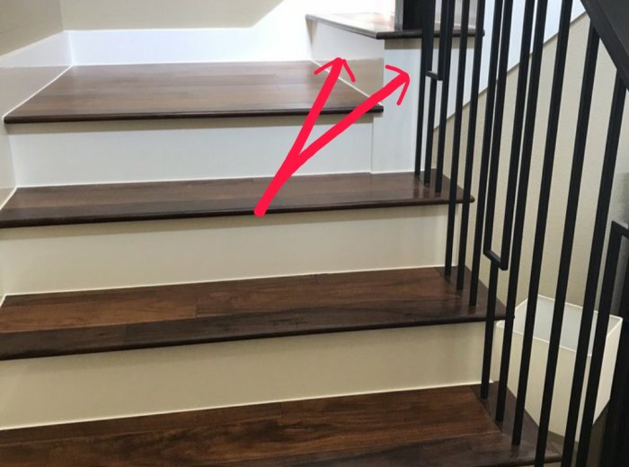 Wood stairs with white painted face remodel in Austin TX