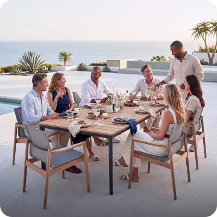 Friends dining at outdoor patio table.