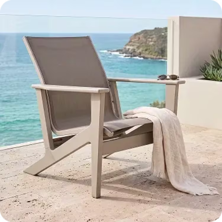 Beige outdoor lounge chair on patio.