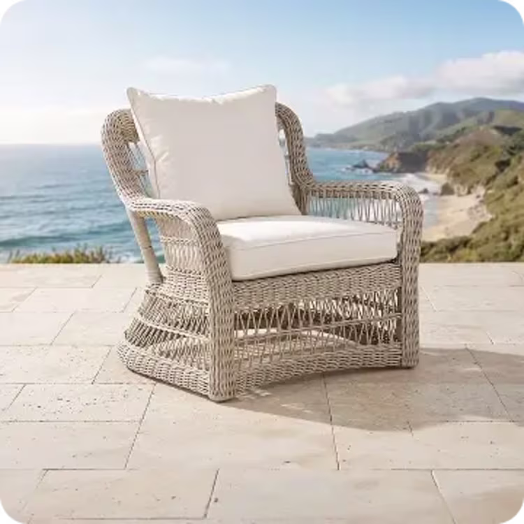 Woven wicker patio lounge chair.