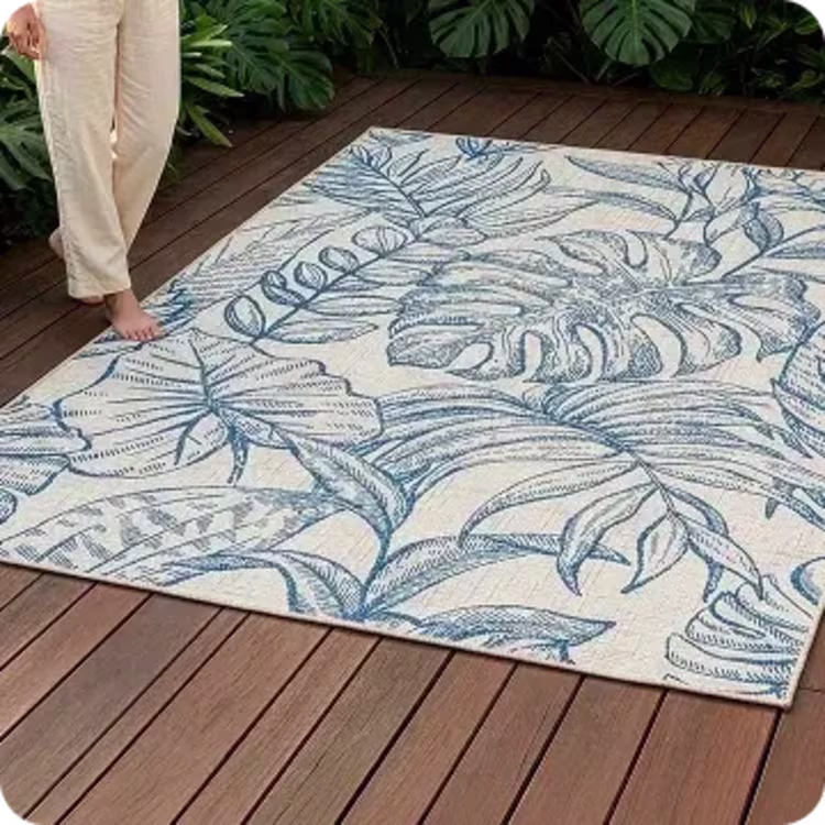 Blue tropical-leaf rug on deck.