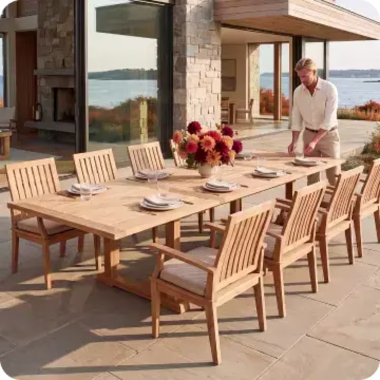 Outdoor dining table set for a fall meal on a waterfront patio.