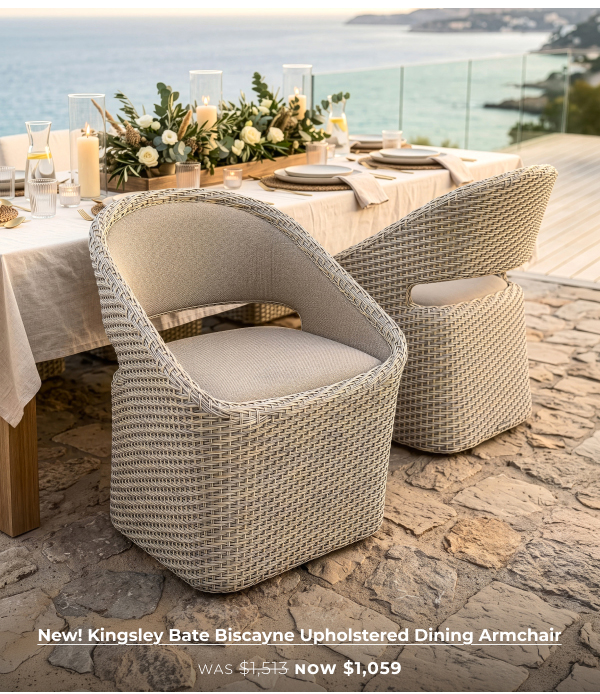 Woven outdoor armchairs at dining table. Image Text: New! Kingsley Bate Biscayne Upholstered Dining Armchair WAS $1,513 NOW $1,059