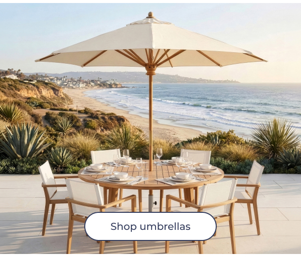 Large cream umbrella over outdoor table. Image Text: Shop umbrellas