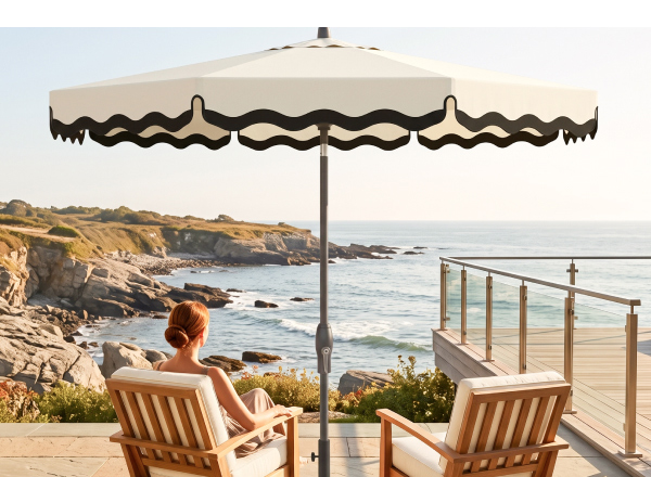 Scalloped Treasure Garden market umbrella shading two coastal lounge chairs