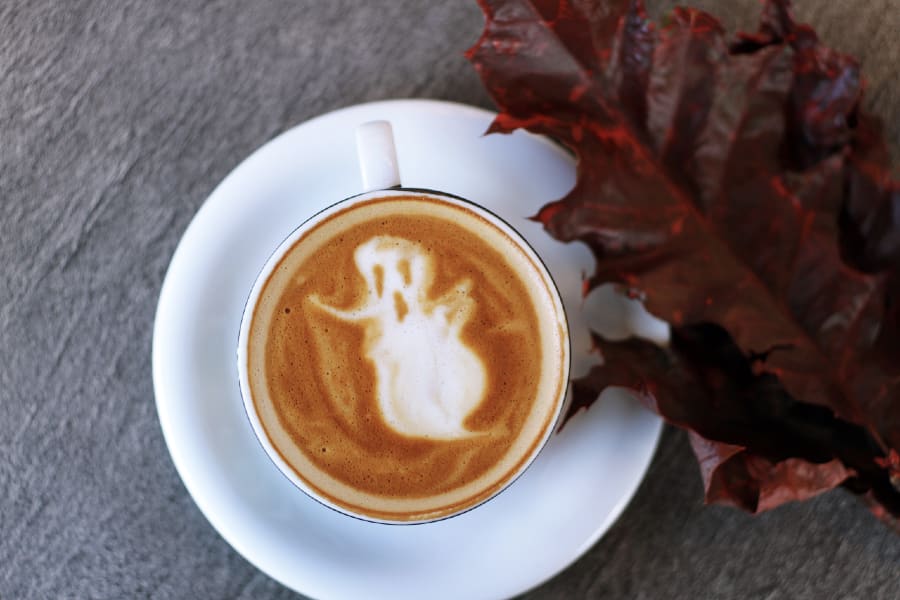coffee with ghost and red leaf