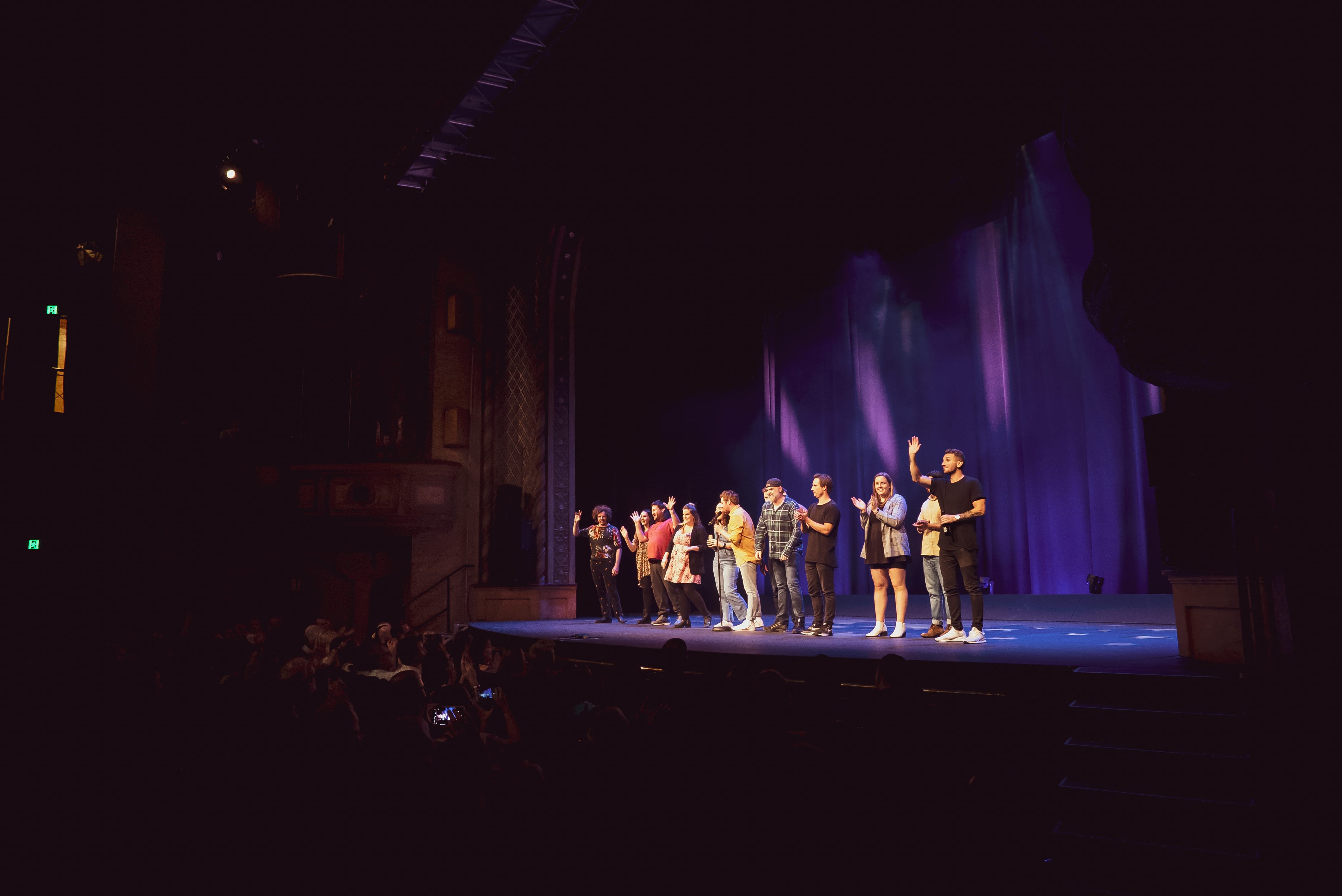 comedians tommy little standing on civic theatre stage at newcastle comedy festival