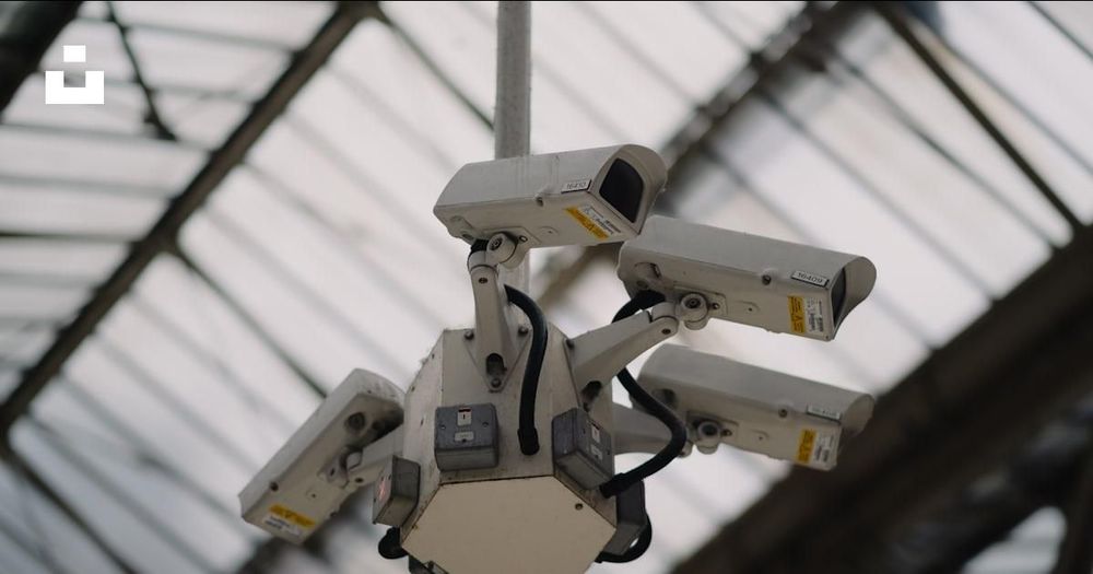 Surveillance cameras installed in London, illustrating modern monitoring technology.