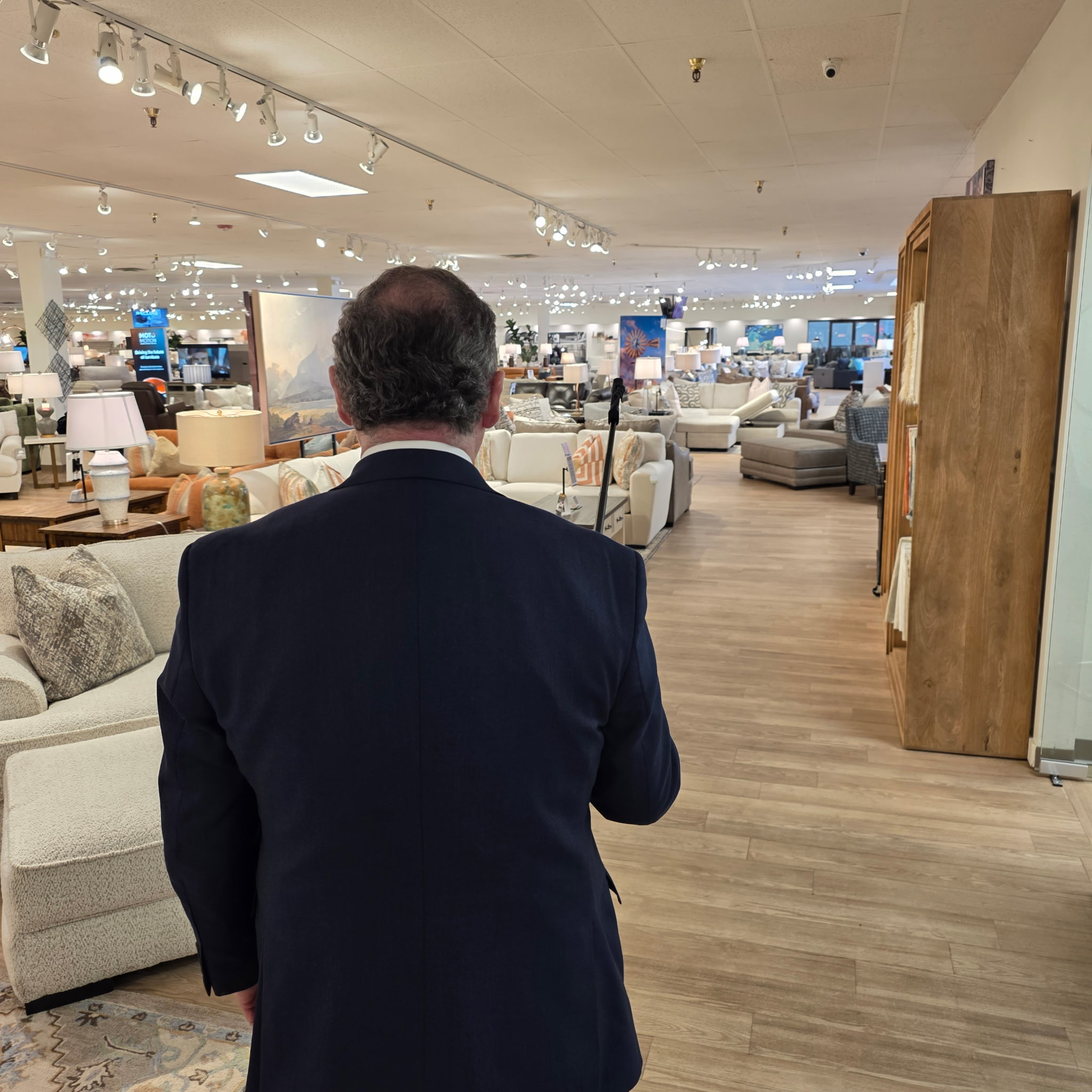 Store team recording a 360° walkthrough with Avatour camera kit in Bob Mills showroom