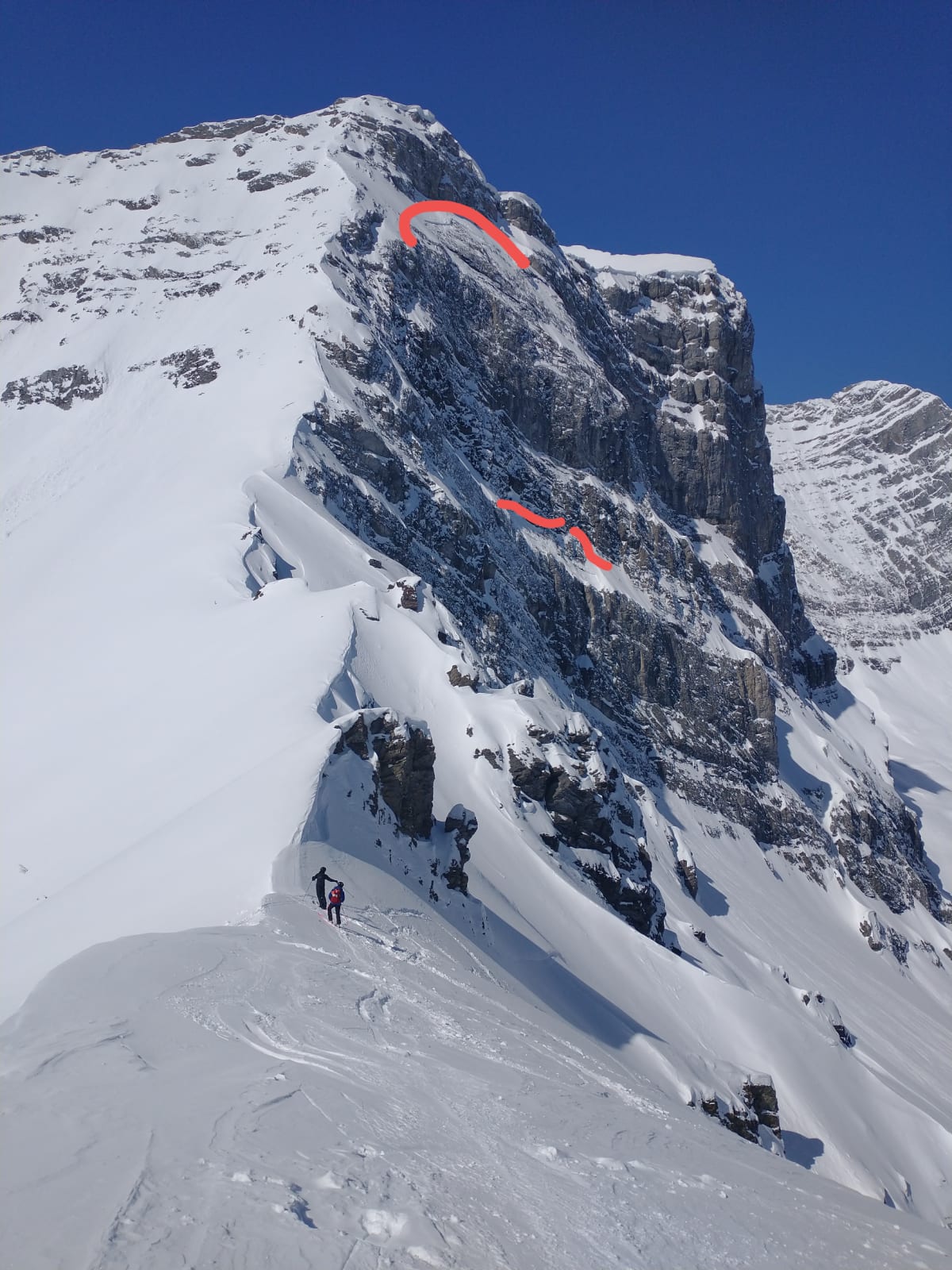 Crown lines on steep NE for the recent avalanche washing over lower portion of run