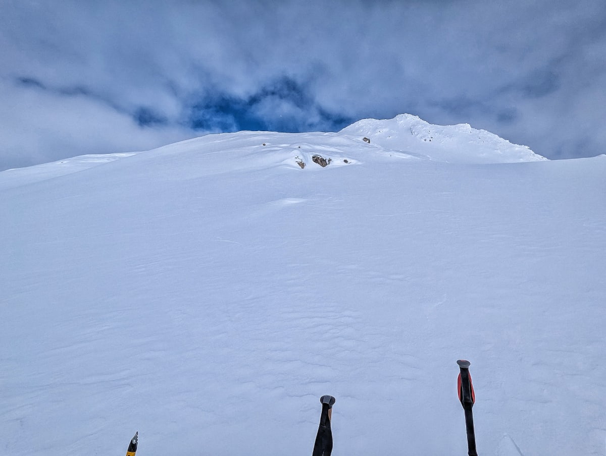 Visible cracks to the right and by the rocky outcrop, day's objective in the background