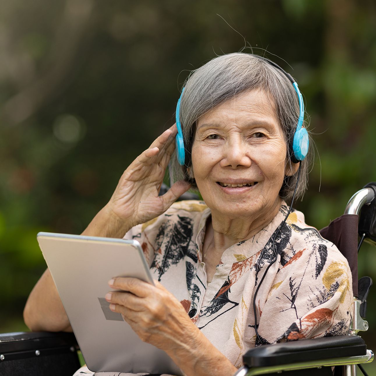 Woman in wheelchair using an assistive listening system