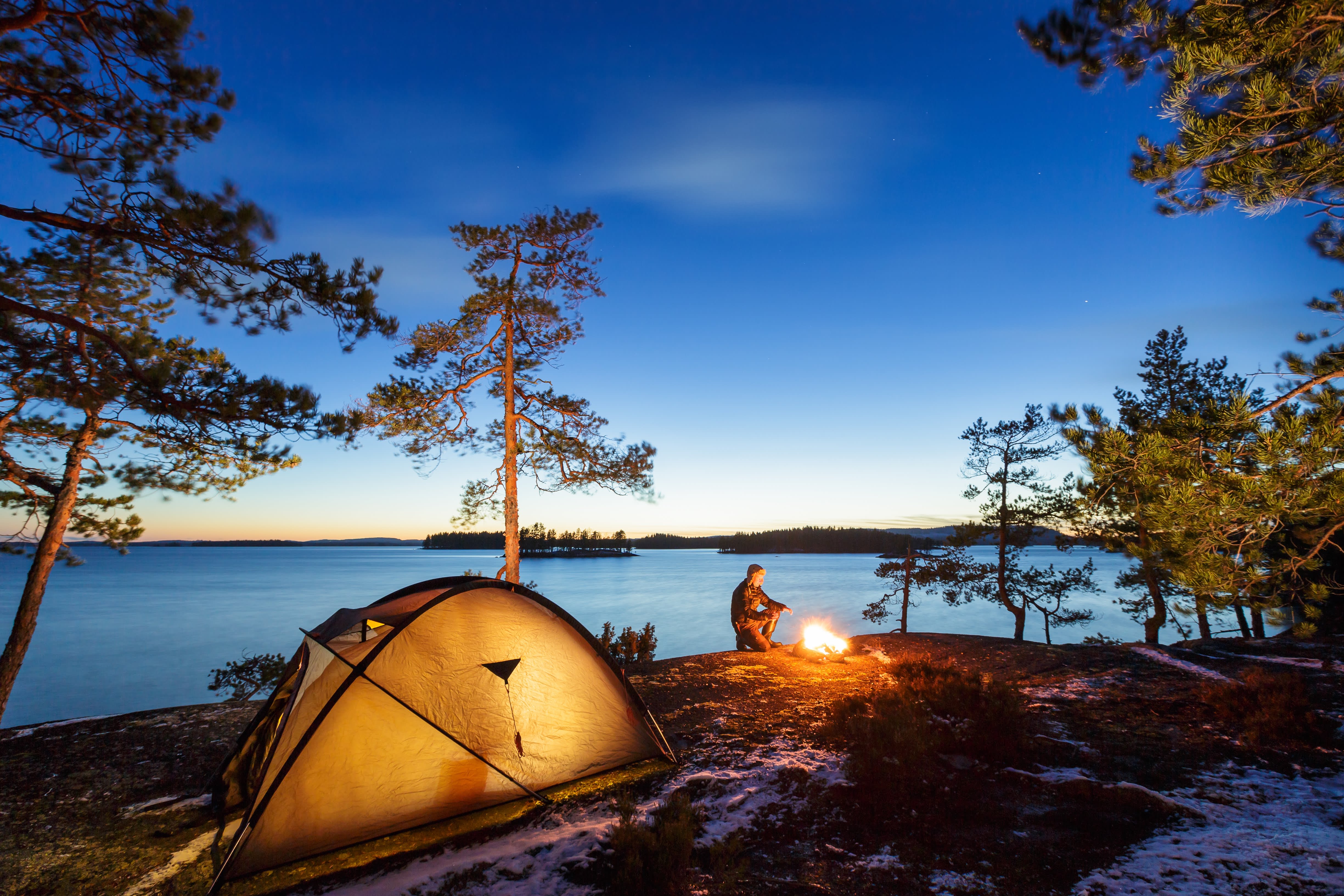 Camper in nature with a fire