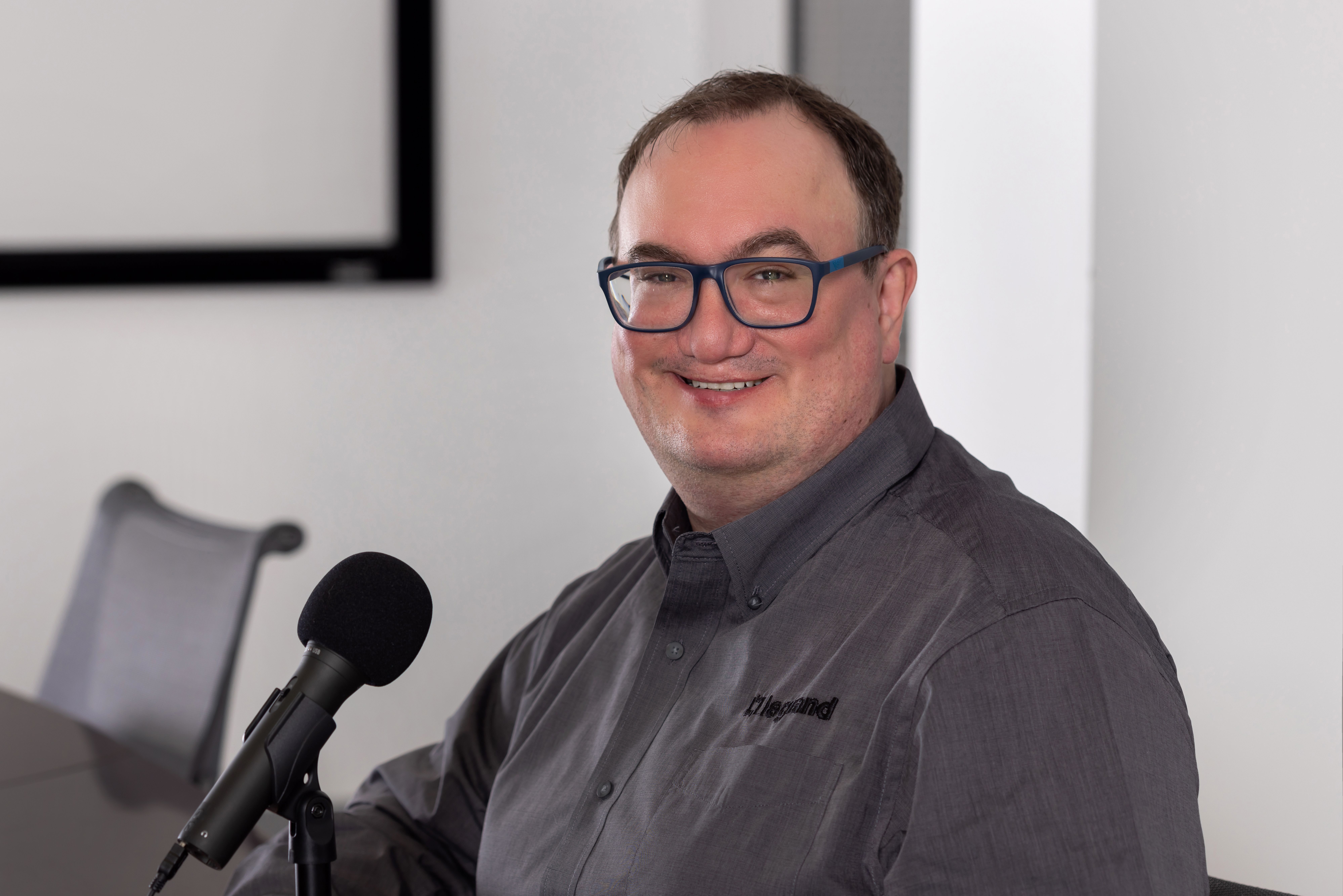 Headshot of Joel, host of the podcast