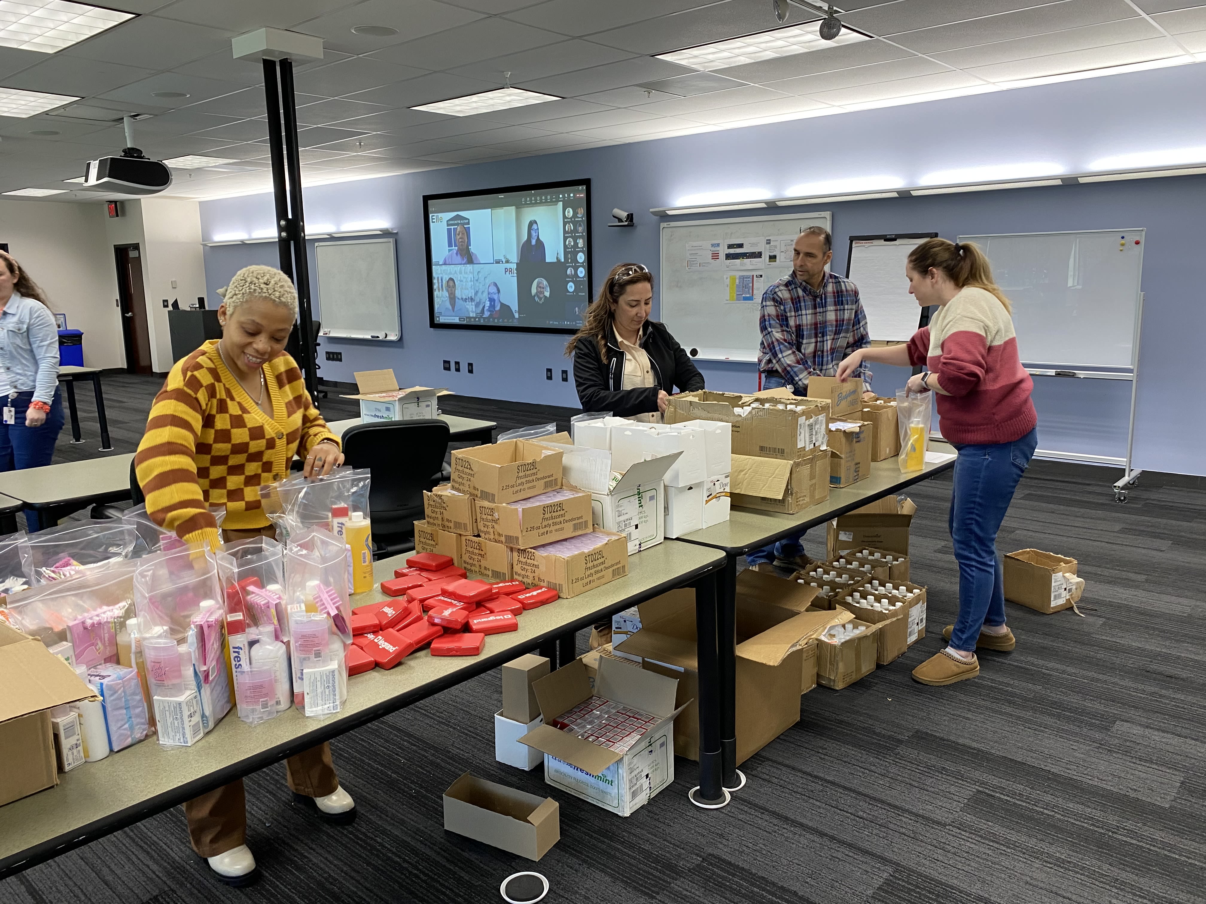 Volunteers putting together care kits.