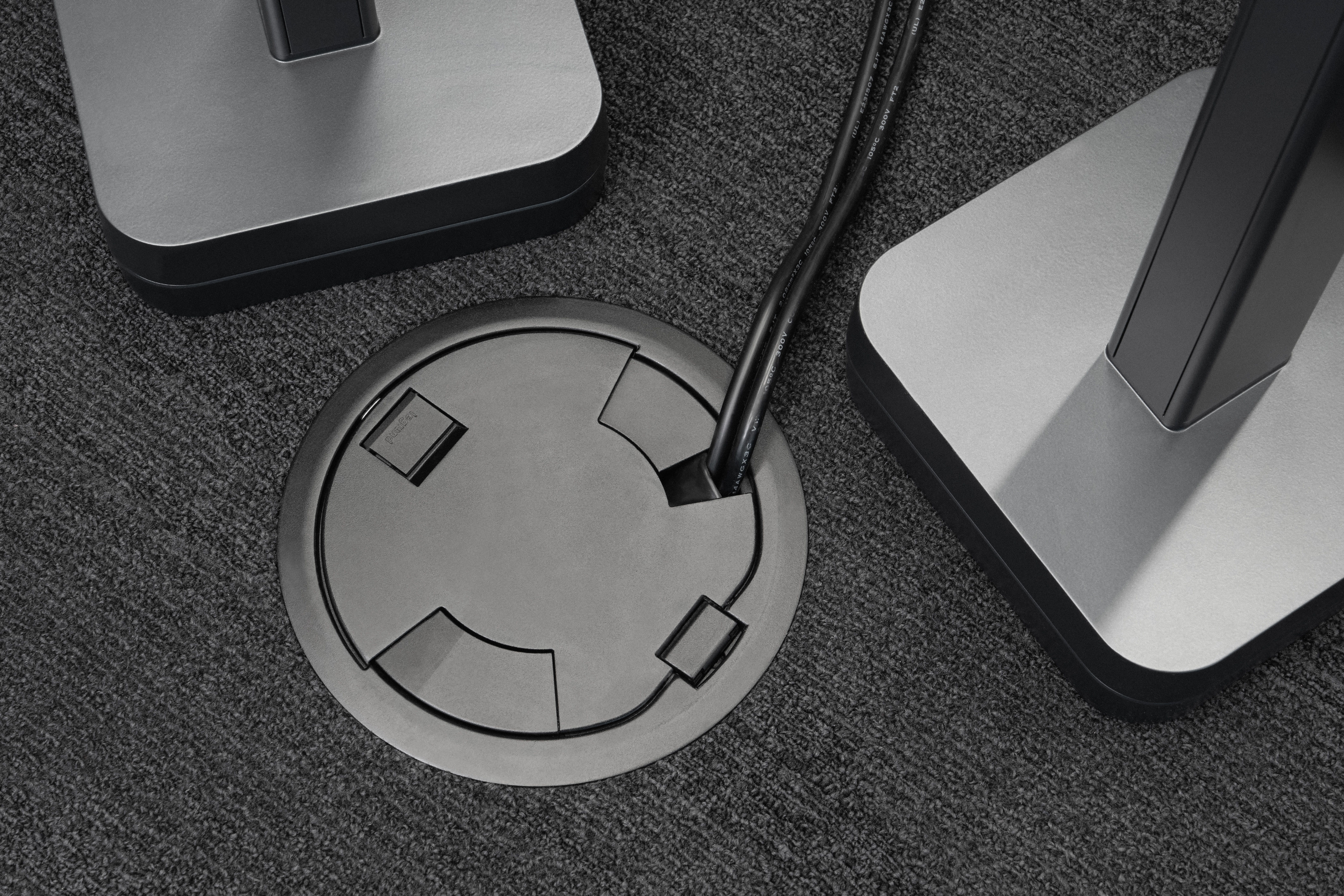 Poke Thru Device with cables coming out of it.