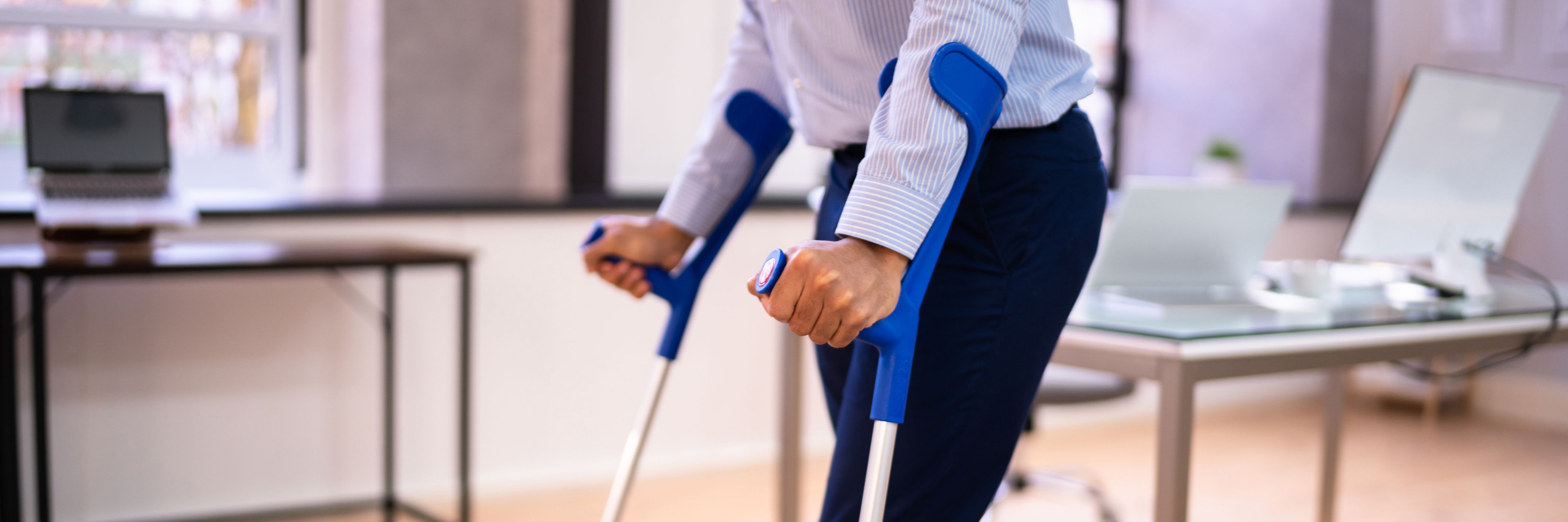 Man using crutches