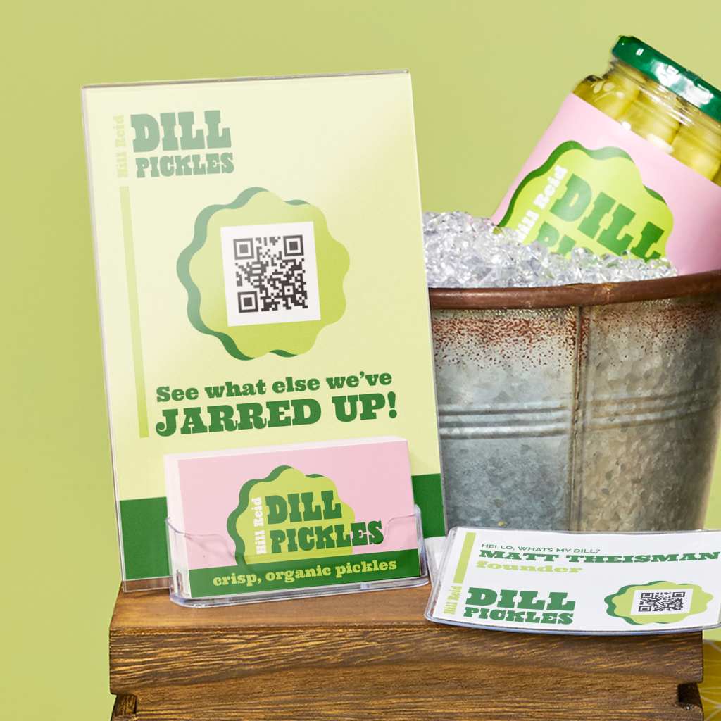 Display of branded business cards with a QR code next to packaged food products, showing how small businesses use business cards at events and booths.