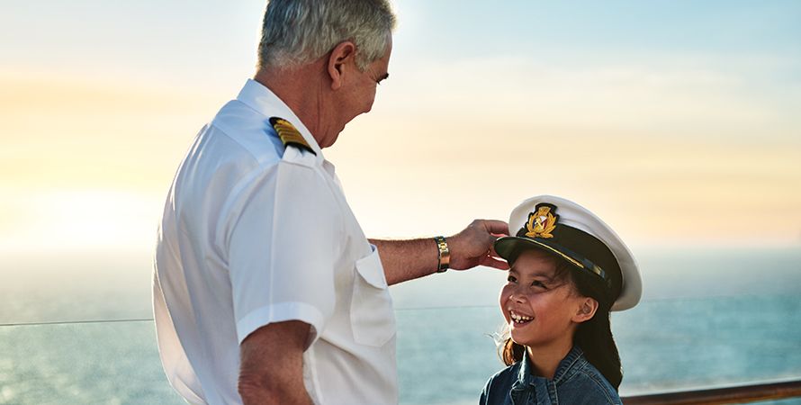 Captain gives captain’s hat to child