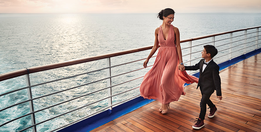 Mother and son walking the deck on Enchanted Princess