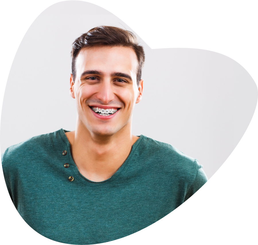 Man smiling wearing braces.
