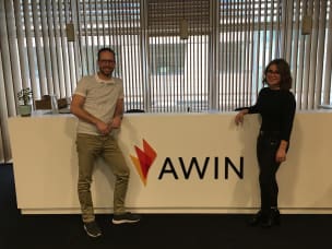 A photo of Fashiola CEO, Peter Langenkamp standing in front of the Awin HQ reception sign.