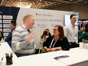 People attending and networking at Awin's stand at Affiliate Summit West 2023